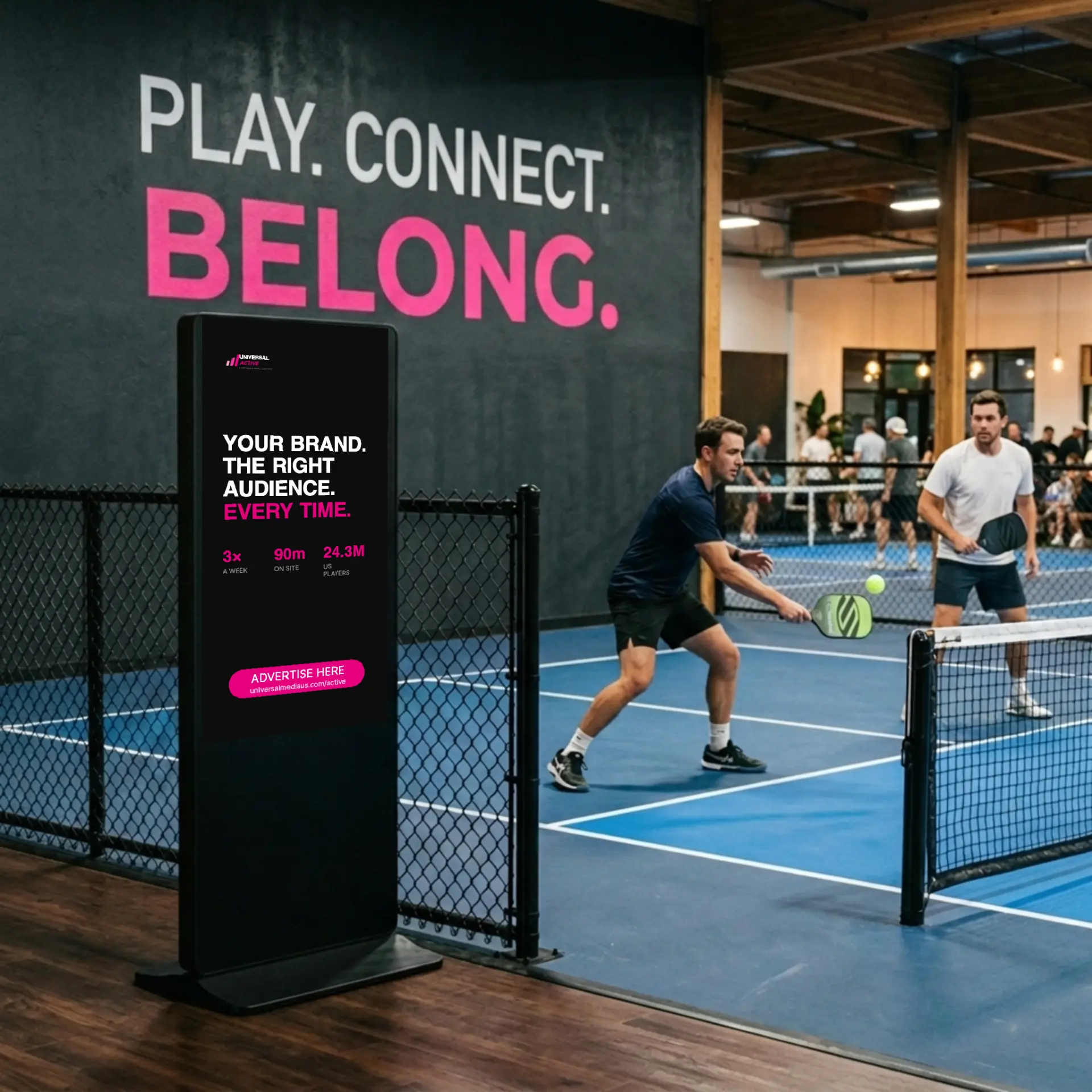 Universal Active display standing courtside at a pickleball club